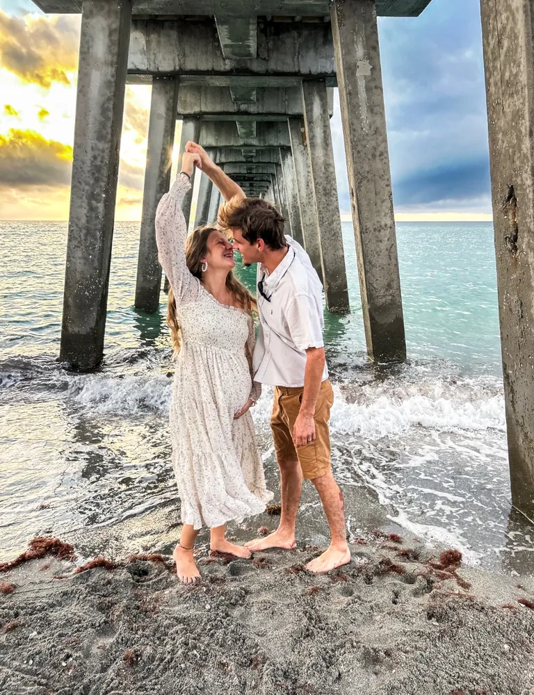 Couple kissing at the shoreline
