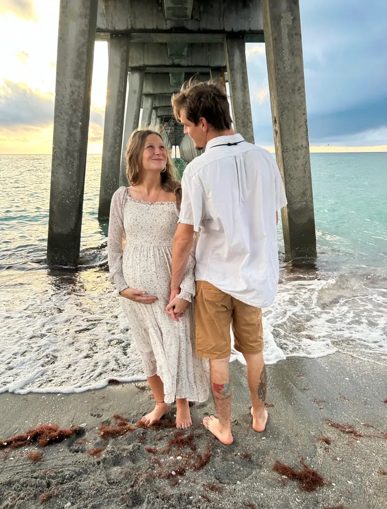 Couple together on the beach at golden hour